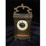 A French carriage clock with enamel face