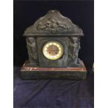 A slate clock on a marble base