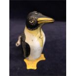 An early 1950's tin plate mechanical penguin with key, stamped 'Made in Great Britain'