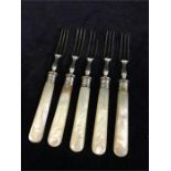 Silver mounted forks with mother of pearl handles