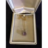 A 9ct gold necklace with amethyst pendant