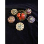 Six glass paperweights