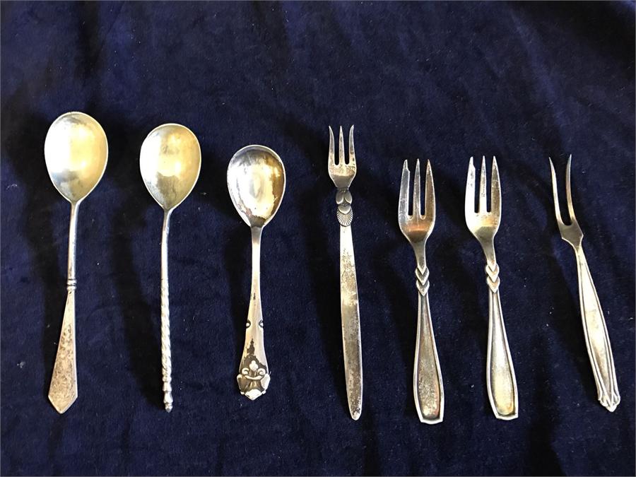 A selection of silver spoons and forks including Georg Jensen