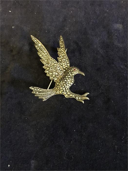 A silver and marcasite brooch of an eagle