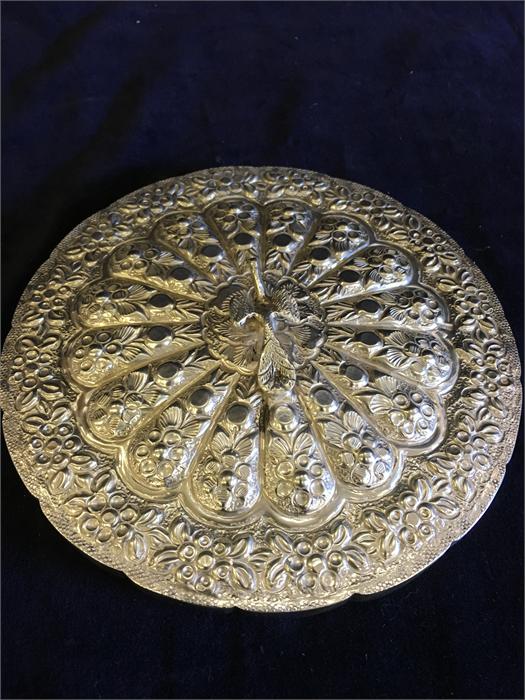 An Arabian silver backed mirror