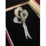 Diamond set platinum rope edged stylised ribbon bow brooch by Sterle of Paris. Dimensions 35 x