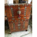 An Oriental chest with metal fixings and decoration