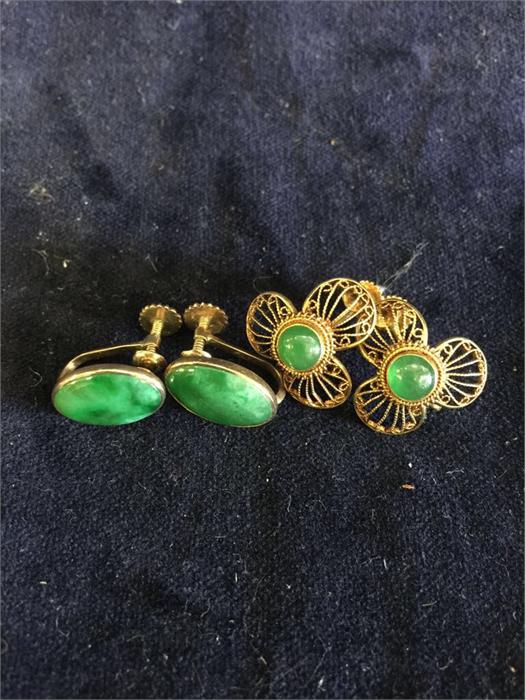 Two pairs of 14k gold and jade earrings