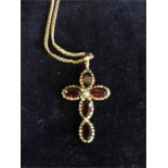 A 9ct gold necklace with cross.