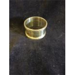 A silver napkin ring, hallmarked London