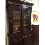 A display cabinet in mahogany