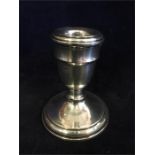 A silver candle holder, hallmark 1923 London, Makers Mark: JE (38g filled)