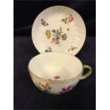 A Meissen tea cup and saucer with a floral design, mid 18th Century