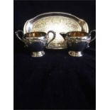 A silver plated sugar bowl, milk jug and tray