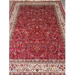 A red ground cashmere rug with traditional tree of life design 2.30m x 1.60m