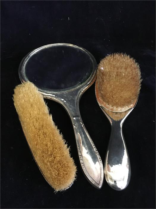 Various silver backed dressing table set.