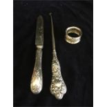 Assorted silver items, napkin ring, silver handled knife, silver lace