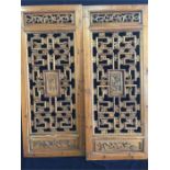 A Pair of carved Oriental screens