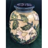 A Moorcroft 'Fruit Garden 14 cm vase