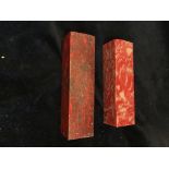 Two red soapstone blocks