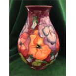 A Moorcroft pansy vase 19cm in height