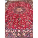 Large Red ground Persian Mashad Carpet with multi coloured floral medallion design 3.90 x 2.83