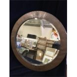 An Arts And Crafts Copper framed circular mirror
