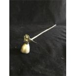 A white metal candle snuffer