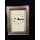 A Kitney & Co silver framed clock