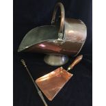 A copper coal scuttle and shovel