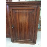 An Oak corner cabinet