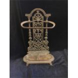 A cast iron umbrella stand