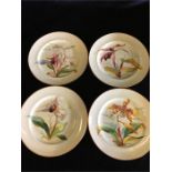 Four hand painted with a floral design china plates