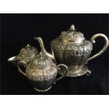 A Indonesian tea set to include tea pot, sugar bowl, milk jug, tea pot stand marked .800 (1,441g)