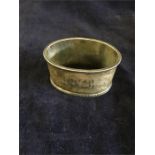 A silver napkin ring hallmarked Birmingham