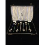 Boxed silver and enamel spoons (seven) by Garrard & Co hallmarked Birmingham 1955