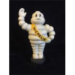 A Cast Iron Michelin Man on a tyre