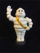 A Cast Iron Michelin Man on a tyre