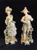 A Pair of hand painted porcelain figures.