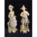 A Pair of hand painted porcelain figures.