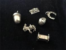 A selection of silver charms