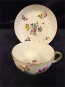 A mid 18th Century Meissen tea cup and saucer with a floral design.