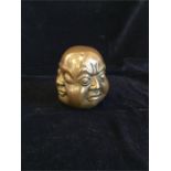 A Decorative four face Buddha Head