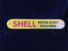 A Large cast iron shell sign