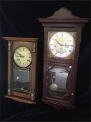 A pair of wall mounted clocks