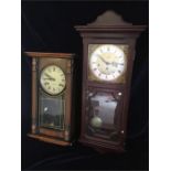 A pair of wall mounted clocks