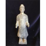 An Antique Chinese bottle in the shape of a man