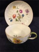 A mid 18th Century Meissen tea cup and saucer with a floral design.