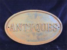 A Large rusty style cast iron Antiques sign