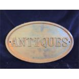 A Large rusty style cast iron Antiques sign